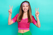 Photo of optimistic friendly hippie girl straight hairdo wear pink top showing v-sign greetings isolated on turquoise color background