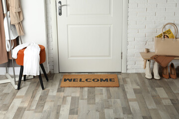 Canvas Print - Doormat with word Welcome on wooden floor in hall