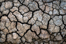 Dry Soil Surface With Deep Cracks Textured Background. Dried And Cracked Soil. Climate Change. Desertification. Cracked Earth, Texture Of Grungy Dry Cracking Parched Earth. Global Warming Effect.