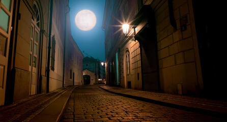 Wall Mural - old night street of Prague and the full moon in the night sky