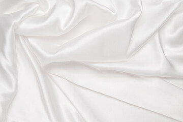 Wall Mural - Abstract white fabric texture background. Cloth soft wave. Creases of satin, silk, and cotton.