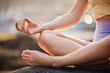 Woman, hands and yoga in meditation for wellness, exercise or workout for healthy wellbeing in the outdoors. Female hand in fitness, spiritual training and meditating for mind, body and awareness