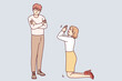 © drawlab19 - Woman kneel ask forgiveness from man. Female stand on knees beg stubborn offended male to forgive. Relationship problems. Vector illustration.