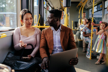 Wall Mural - Young couple on a city bus