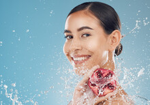 Skincare, Pomegranate And Healthy Woman With Organic Skin Care For Fresh Face On A Studio Background. Fruit, Food And Vitamin C For Glowing, Smooth Skin For Natural Beauty And Cosmetic Treatment