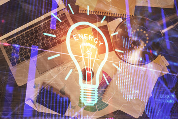 Poster - Bulb drawing over computer on the desktop background. Top view. Double exposure. Idea concept.