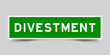 Sticker label with word divestment in green color on gray background