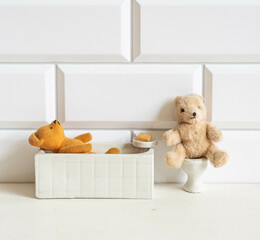 Wall Mural - Small vintage teddy bears in the bathroom - taking a bath and using the toilette - dollhouse furniture