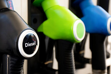 Diesel And Petrol Pumps On A Gas Station. Fuel Nozzles Oil Dispensers. Petrol Gas Diesel Fuel Prices Concept