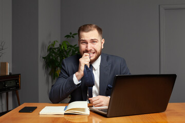 Professional adult businessman is working in office and care about his work