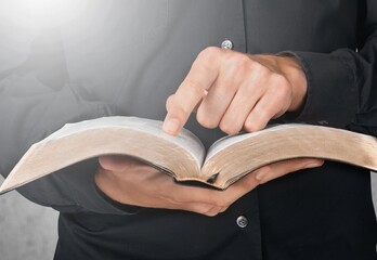 Wall Mural - Christian person's hands with holy Bible book