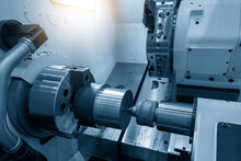 The  CNC Lathe Machine Forming  Cutting The Metal Shaft Parts.