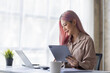 © David - Happy young Asian entrepreneur woman in Colored hairs counting profit, on calculator at laptop computer, analyzing benefits, enjoying financial success, job high result, smiling