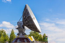Soviet Satellite Dish Antenna Orbita Against Blue Sky Background. Old Equipment For Telecommunication