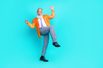 Sticker - Full body portrait of overjoyed cheerful aged person raise fists shout yes isolated on emerald color background