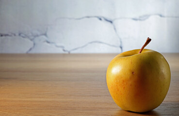 Wall Mural - yellow apple on a wooden background