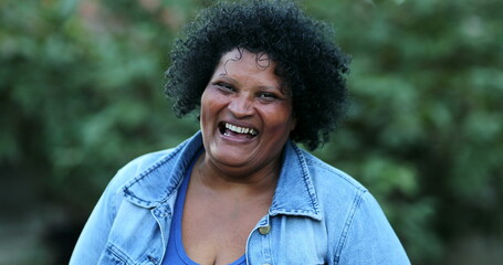 Joyful Brazilian casual woman smiling and laughing. Hispanic latin black person, happy person