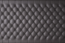 Black Genuine Leather Upholstery, Chesterfield Style Background. 3D Rendering