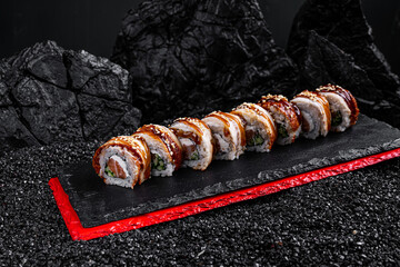 Canvas Print - rolls with eel on a black background