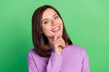 Sticker - Closeup photo of young attractive cute woman smiling touch chin lovely flirty looking you isolated on green color background