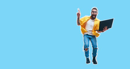 Wall Mural - Jumping, running crazy programmer, web developer or designer holding laptop in hands and pointing to your text. Discount, season sales. Shocked or surprised facial expression. Funny promotion poster