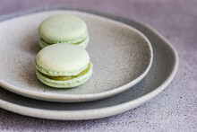 Close-up Of Two Pistachio Macaroons On A Plate