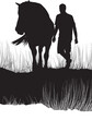 Man and a horse in tall grass