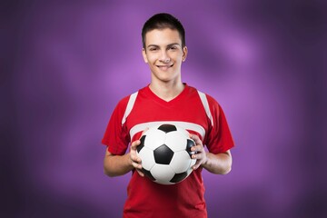 Wall Mural - Young happy fan man with football ball