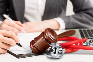 Poster - Doctor writing and medical stethoscope on the desk