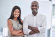 © C D/peopleimages.com - Businessman, black woman or arms crossed in creative office, marketing or advertising company and leadership, power or target goals. Portrait, smile or happy teamwork collaboration in success mindset