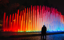 People Looking At An Impressive And Colorful Fountain In The Magic Water Circuit At Reserve Park, Lima, Peru