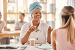© C D/peopleimages.com - Business women, planning and strategy for marketing and advertising project while discuss company startup project. Black woman and employee with teamwork, collaboration and conversation on business