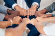 © Clayton D/peopleimages.com - Hand, Fist or diversity business men and women teamwork together in mission, trust or goal in top view. Hands of business people support, team building or strategy meeting in corporate global success