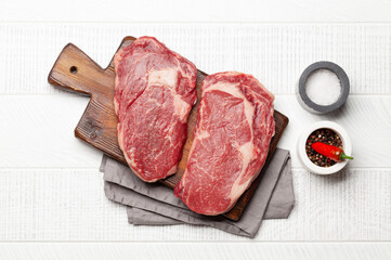 Wall Mural - Two raw ribeye beef steaks