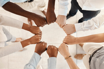 Diversity, solidarity and hands of business people in circle for teamwork, collaboration and synergy for team building in a corporate office. Men and women group together for support, trust and power