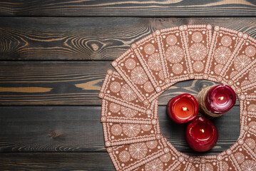 Wall Mural - Tarot cards on the old wooden table of fortune teller baackground with copy space. Top view.