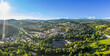 Luftaufnahme einer Drohne der Stadt Grafenau im bayerischen Wald mit Berg Arber Rachel Lusen im Sommer mit Sonne und Sonnenstrahlen, Deutschland