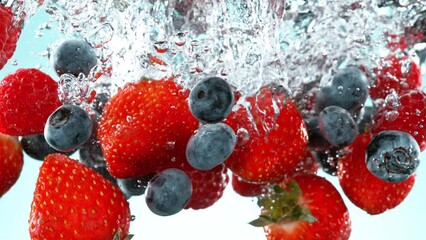Fototapete - Super slow motion of falling berries underwater. Filmed on high speed cinema camera, 1000 fps.