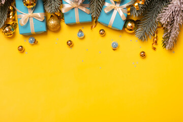 Wall Mural - christmas background with pine tree, gifts and festive decorations top view. christmas flat lay. cop