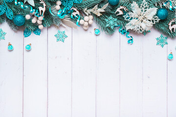 Wall Mural - Christmas background made from pine tree, berries and festive decorations top view. Christmas flat lay