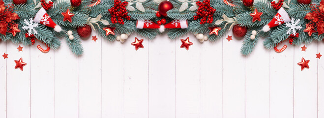 Wall Mural - Christmas banner composition made from pine tree, stars and festive decorations top view. Christmas flat lay.