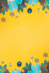 Wall Mural - christmas vertical background with pine tree, gifts and festive decorations top view. christmas flat