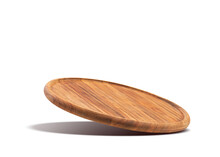 Round Wooden Pizza Board Falling On A White Background. Food Preparation. Culinary Background.