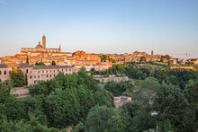 Panoramic View Of Siena, The Dome And Bell Tower Of Siena Cathedral (Duomo Di Siena), Ancient Houses At Sunset Lights.