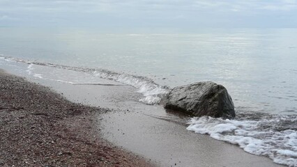 Poster - Stone at Baltic Sea shore on autumn. Calm sea