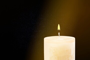 Canvas Print - Burning candle light on dark background