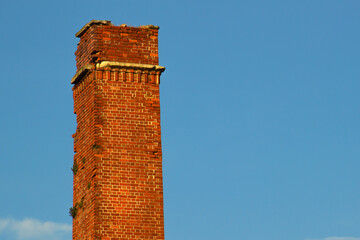 old brick chimney isolated in the sky