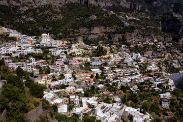 Wall Mural - Panoramic view of beautiful Amalfi Positano on hills leading down to coast, Campania, Neaples, Italy. Amalfi coast is most popular travel and holiday destination in Europe.