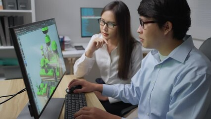 Team people designer working at office together. They using computer to design 3d game together. Technology, Designer, Development, Engineering concept.