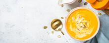Pumpkin Soup Puree With Cream In The Bowl. Long Banner Format.